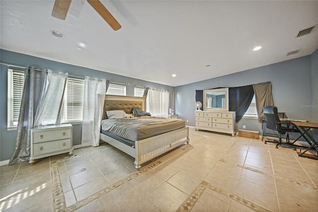 bedroom with ceiling fan and light tile patterned flooring