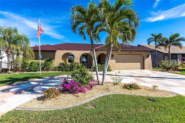 mediterranean / spanish-style house with a garage