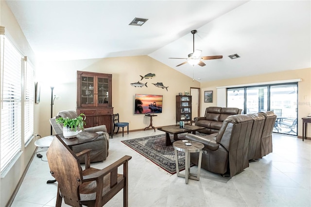 tiled living room with ceiling fan and lofted ceiling