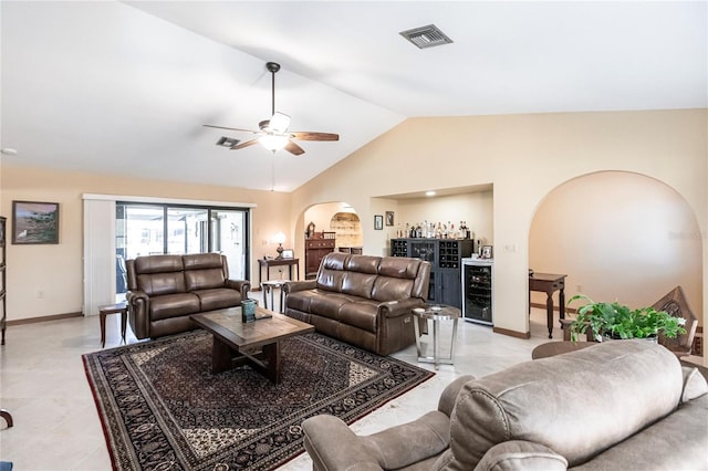 living room with bar, ceiling fan, lofted ceiling, and wine cooler