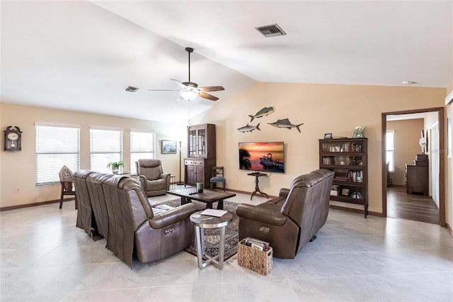 living room featuring ceiling fan and vaulted ceiling