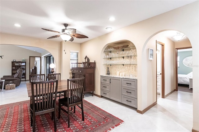 dining room featuring ceiling fan