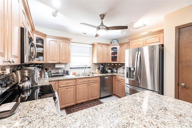 kitchen with ceiling fan, light brown cabinets, sink, and appliances with stainless steel finishes