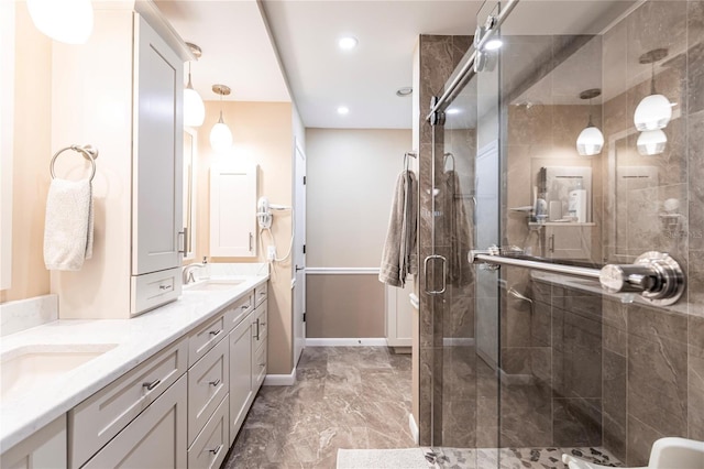 bathroom featuring vanity and a shower with door