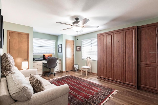 office with hardwood / wood-style floors and ceiling fan