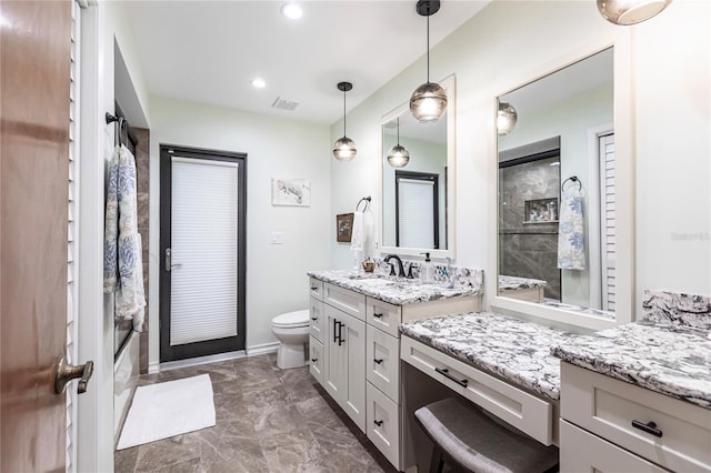 full bathroom with vanity, toilet, and bath / shower combo with glass door