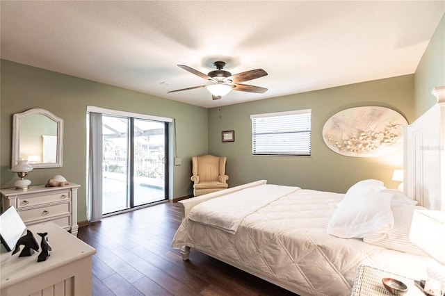 bedroom with access to exterior, ceiling fan, and dark wood-type flooring