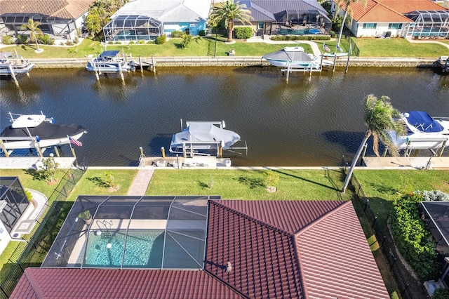 birds eye view of property with a water view