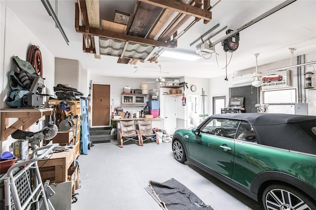 garage with a workshop area and a garage door opener