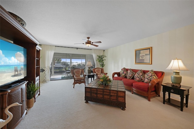 living room featuring ceiling fan and light colored carpet