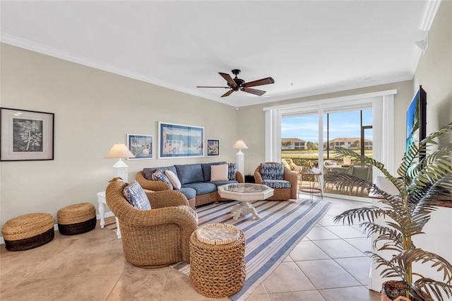 living room with ceiling fan, crown molding, and light tile patterned flooring