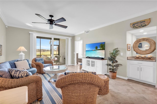 living room with ceiling fan and crown molding