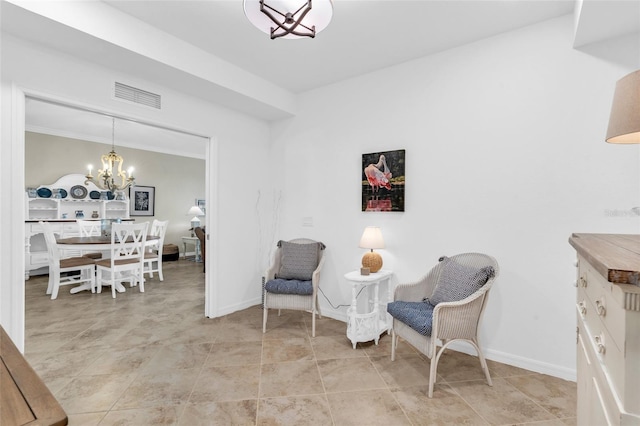 sitting room with an inviting chandelier