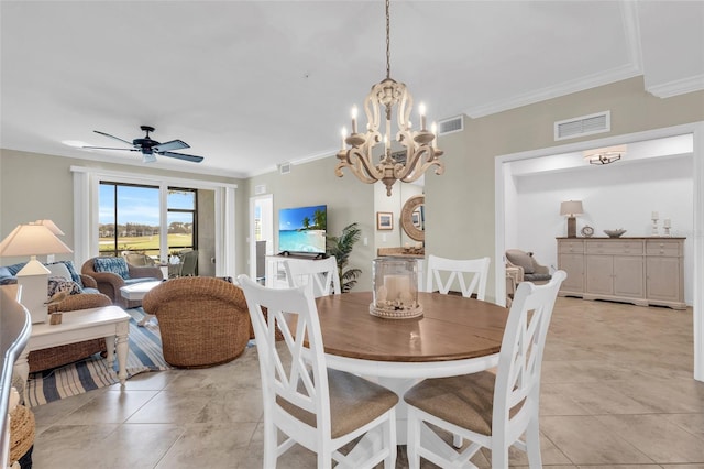 dining room featuring ceiling fan with notable chandelier, ornamental molding, and light tile patterned floors