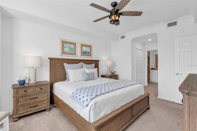 carpeted bedroom featuring ceiling fan, a closet, and ornamental molding