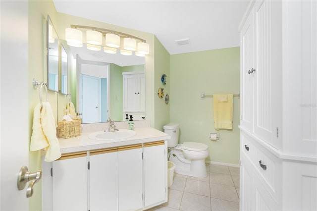 bathroom with tile patterned floors, vanity, and toilet