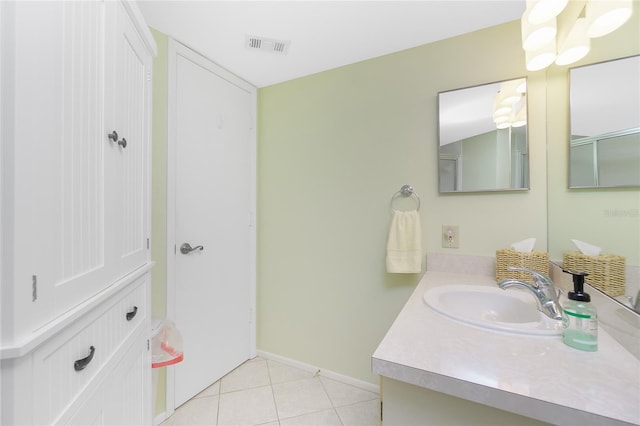 bathroom featuring tile patterned floors and vanity