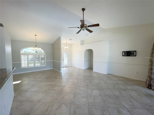 unfurnished room featuring light tile patterned floors, ceiling fan with notable chandelier, and lofted ceiling