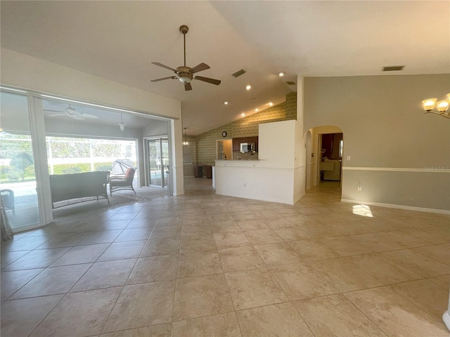 unfurnished living room featuring ceiling fan, light tile patterned flooring, and brick wall