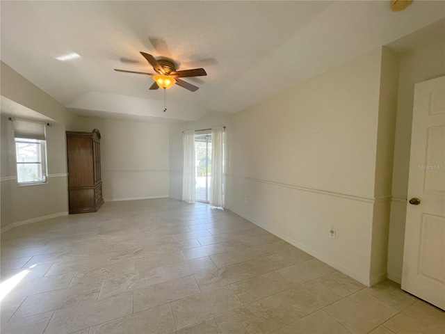 unfurnished room featuring ceiling fan and lofted ceiling