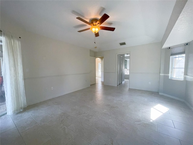 unfurnished room featuring ceiling fan