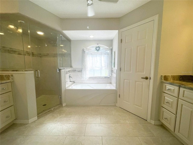 bathroom with vanity, ceiling fan, and shower with separate bathtub