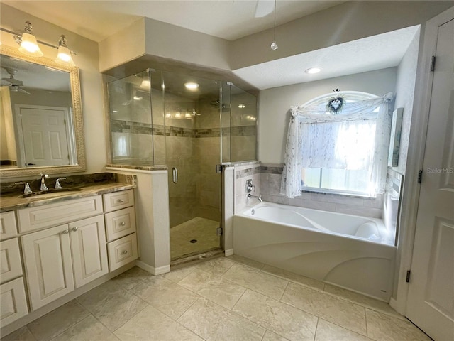 bathroom with vanity, ceiling fan, and plus walk in shower