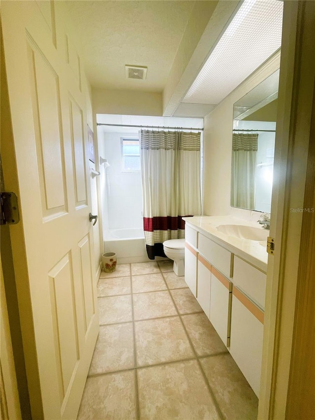 full bathroom with tile patterned flooring, vanity, toilet, and shower / tub combo with curtain