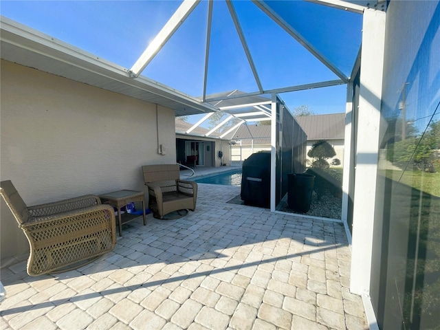 view of patio / terrace featuring a lanai