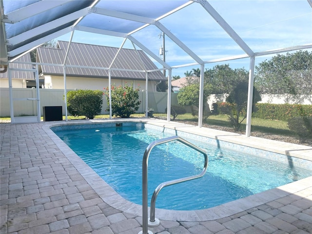 view of pool featuring a patio area and a lanai