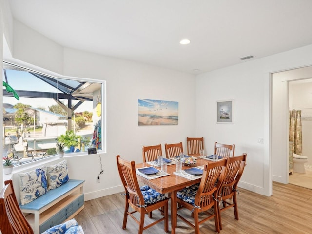 dining room featuring light hardwood / wood-style floors