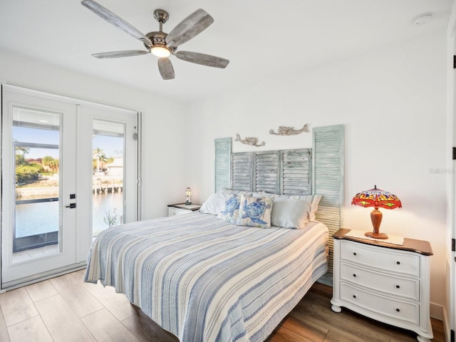 bedroom featuring ceiling fan, light wood-type flooring, and access to outside