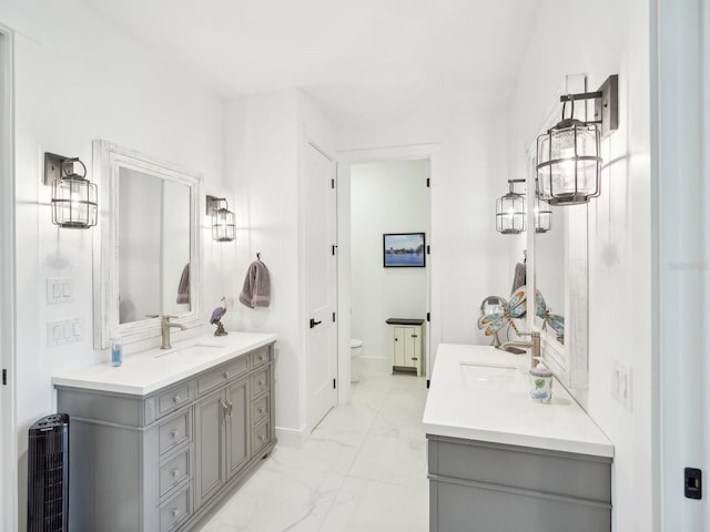 bathroom with vanity and toilet