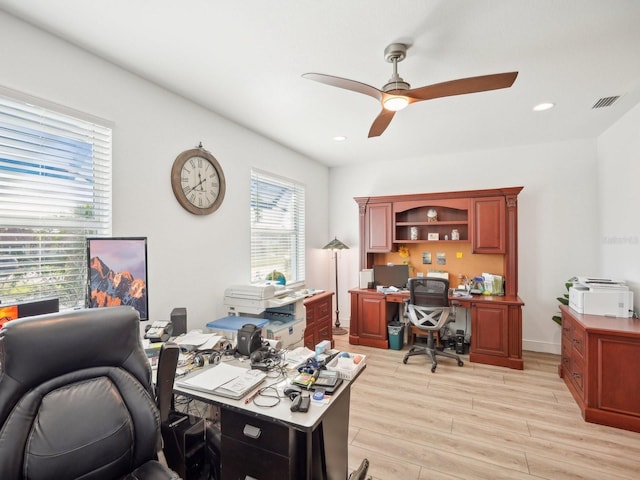 office space featuring light hardwood / wood-style floors and ceiling fan