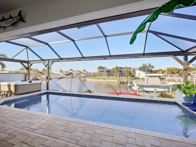 view of pool featuring a boat dock, a hot tub, a water view, and glass enclosure