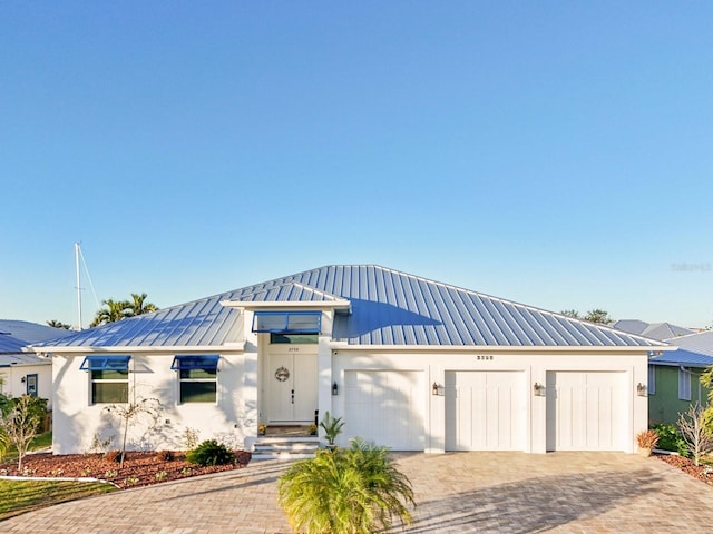 view of front of property featuring a garage