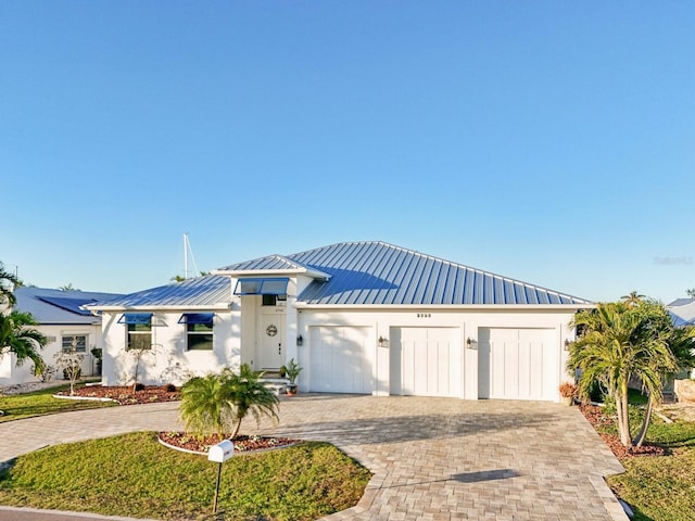 view of front of property with a garage