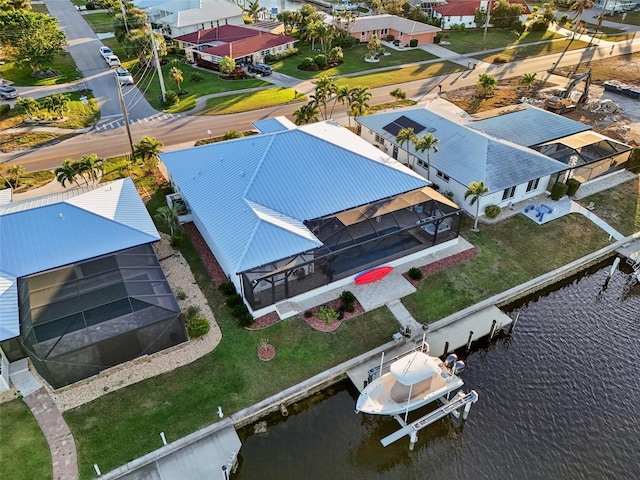 birds eye view of property featuring a water view and a residential view