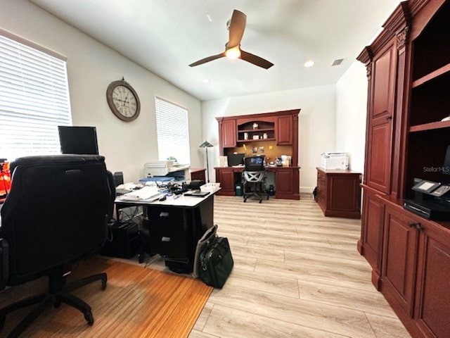 home office with recessed lighting, a ceiling fan, visible vents, and light wood finished floors