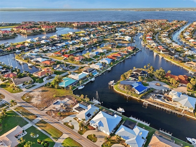 birds eye view of property featuring a residential view and a water view