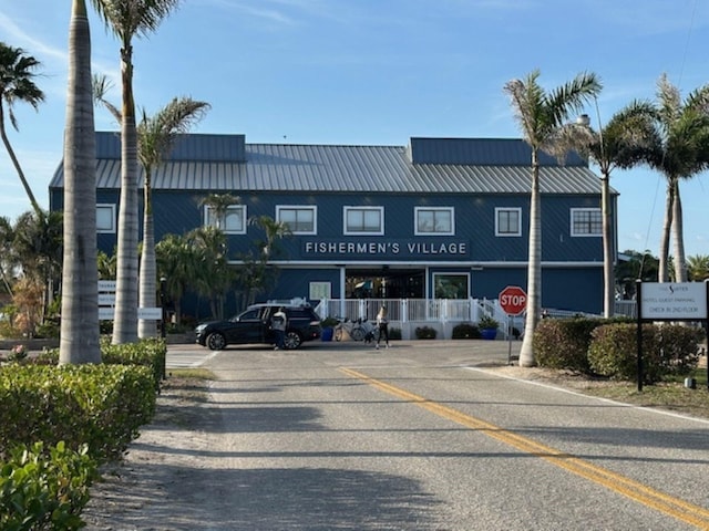 view of property with uncovered parking