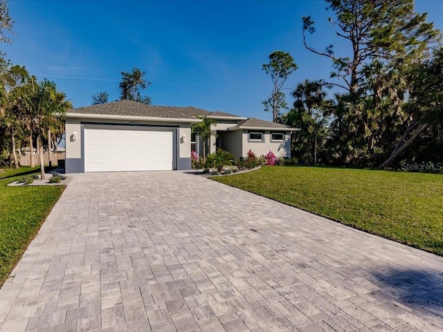 view of front facade with a garage and a front yard