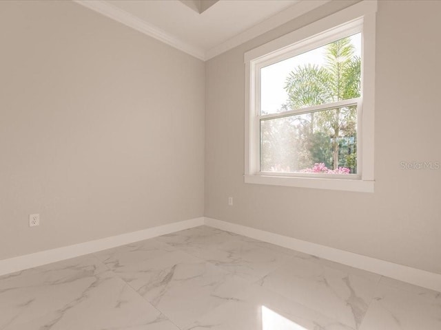 unfurnished room with ornamental molding and a wealth of natural light