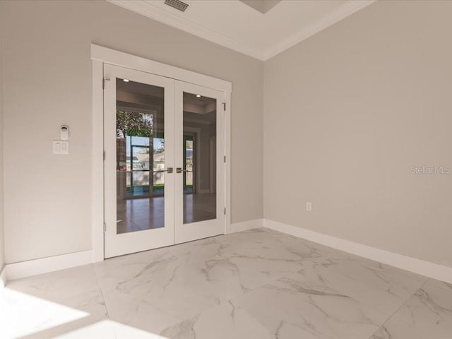 spare room with crown molding and french doors