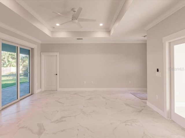 unfurnished room with ceiling fan, a raised ceiling, and crown molding