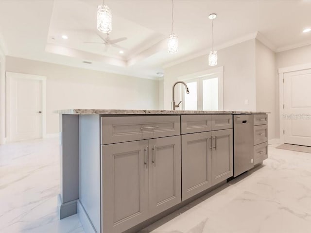 kitchen with a center island with sink, decorative light fixtures, ceiling fan, and gray cabinetry