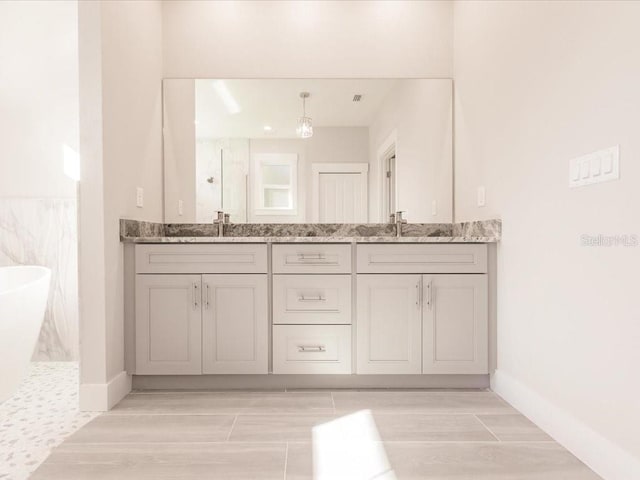 bathroom featuring vanity and a shower