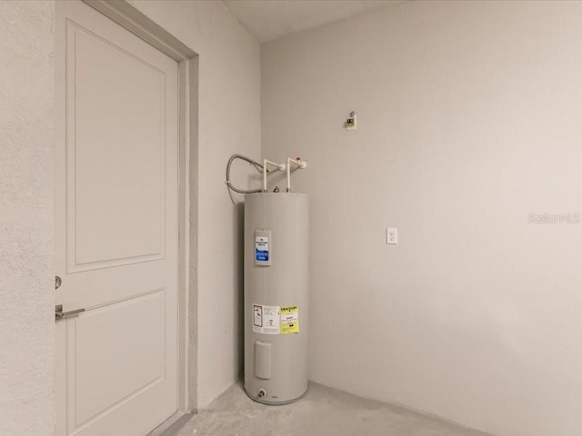 utility room with electric water heater