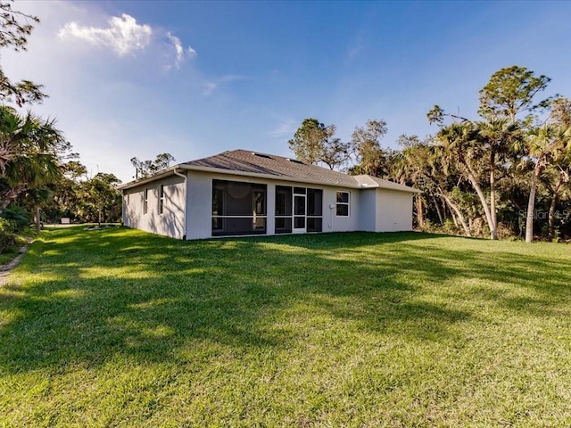 back of house with a yard