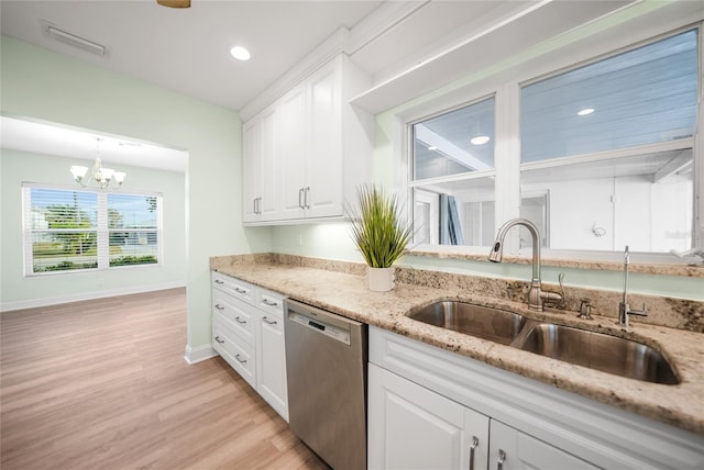 kitchen with dishwasher, white cabinetry, sink, and an inviting chandelier